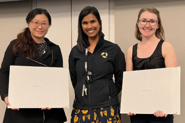 three woman, two of which are holding certificates